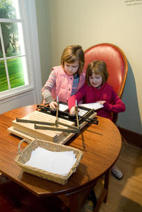 Children operate a working model based on Jefferson's Polygraph copying machine