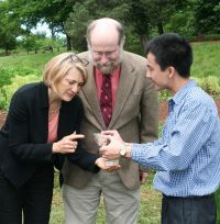 Viet Nguyen (right) presented Vietnamese rice seeds to Monticello