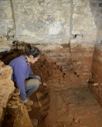 Figure 6: Exposing the original brick floor of the First Kitchen