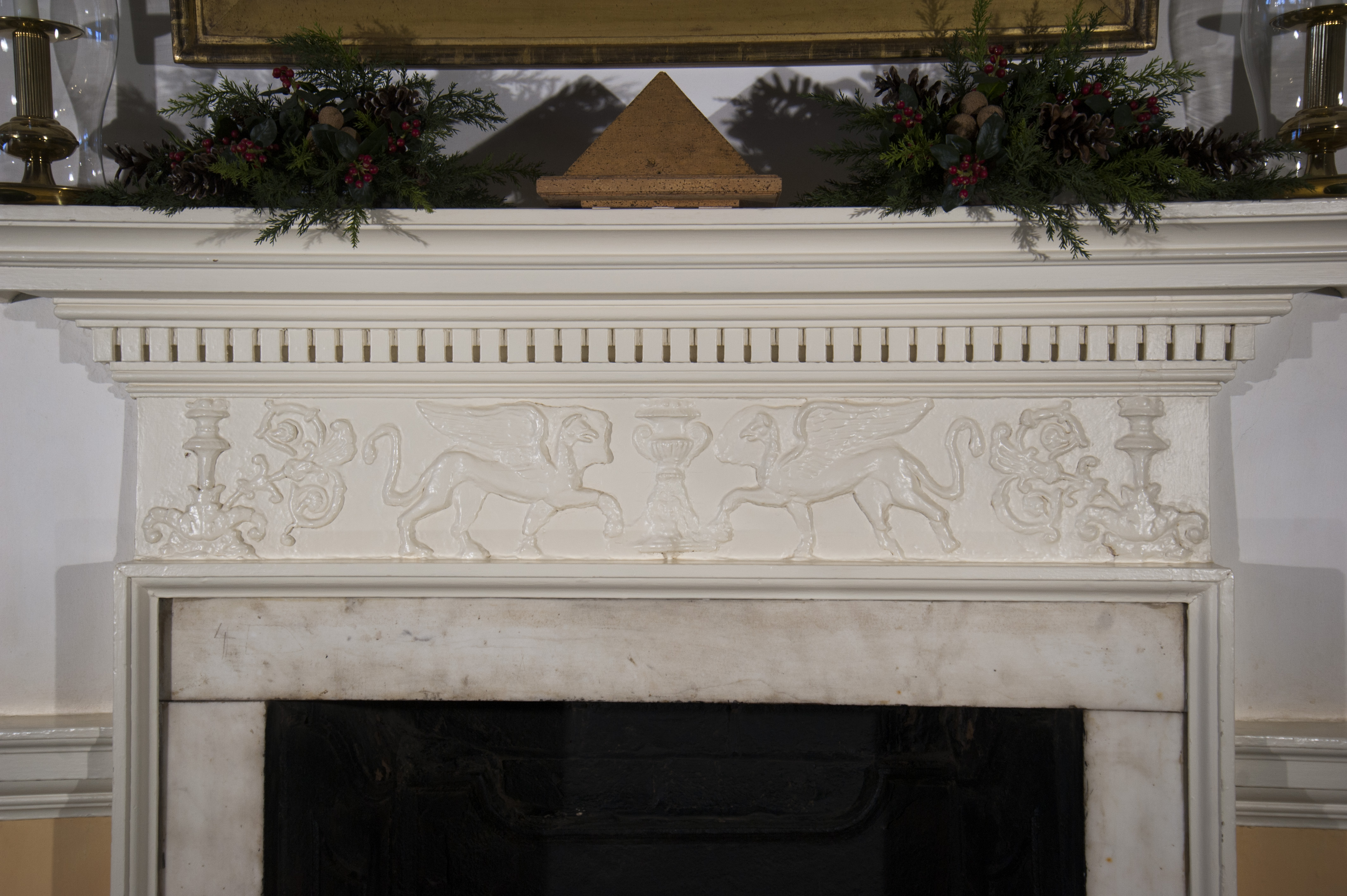 The Entrance Hall chimneypiece frieze, before restoration