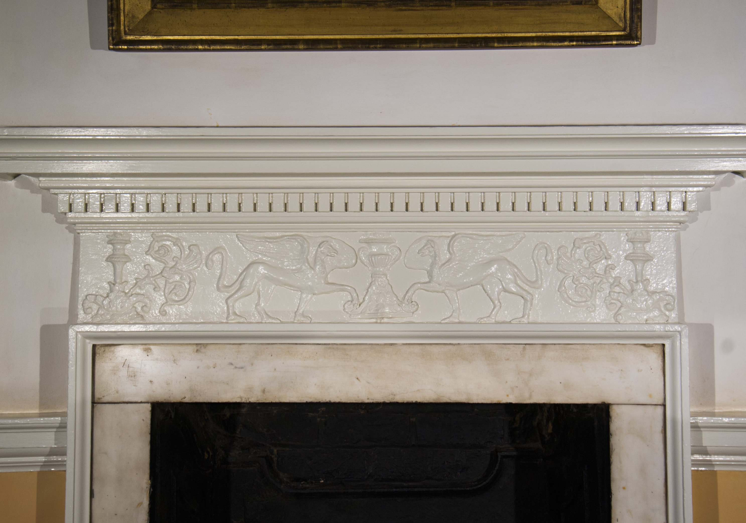 The Hall chimneypiece frieze, with fully restored composition ornament.